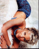 Brittany Daniel relaxing on a blanket in a bikini top photo print
