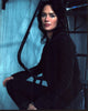 Lena Headey posed on ladder photo print showcasing elegance and charm.