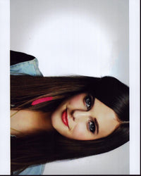 Close-up photo print of Tiffany Alvord in a denim top.
