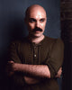 David Lowery photo print with arms crossed in a green top