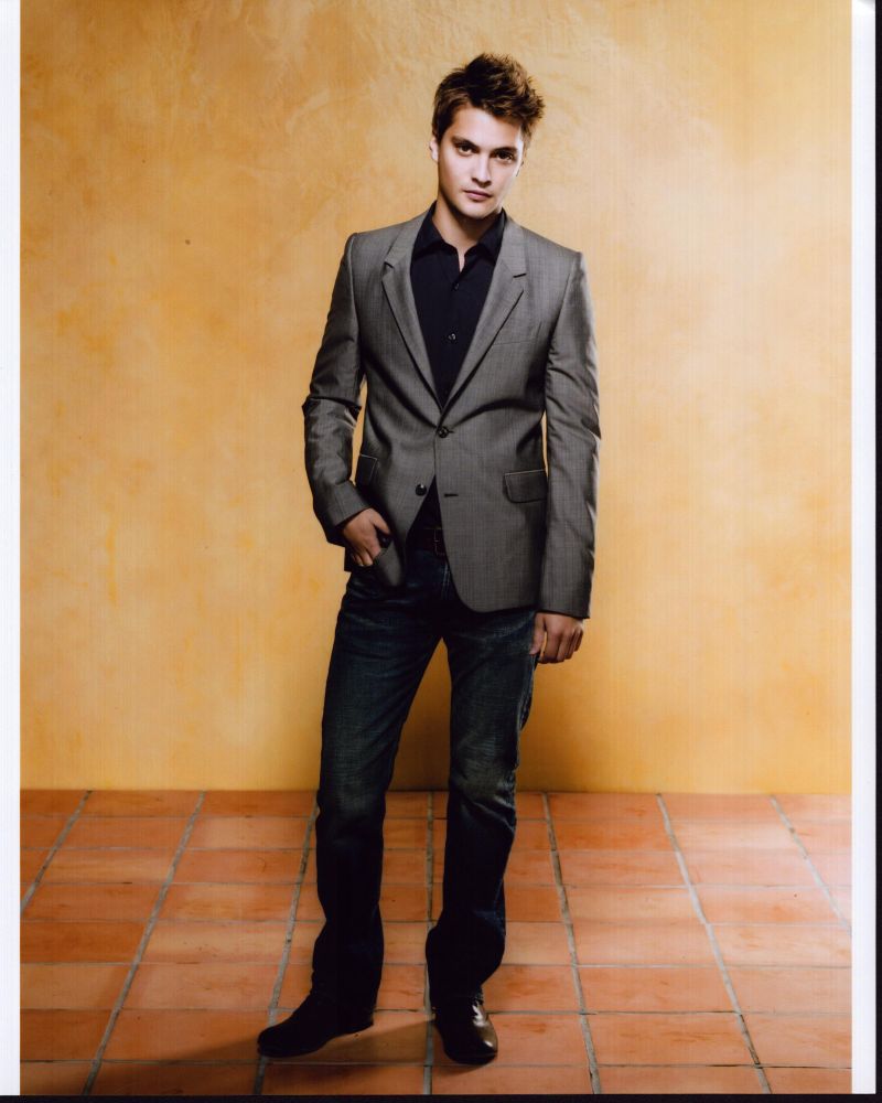Luke Grimes stylish gray suit photo print for home decor.