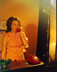 Emily Bell On The Phone Photo Print showcasing candid moment.