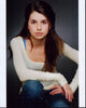 Emma Lockhart in white long sleeve photo print with arm on knee