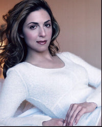 Ellen Dubin in a white sweater photo print, stylish and elegant.