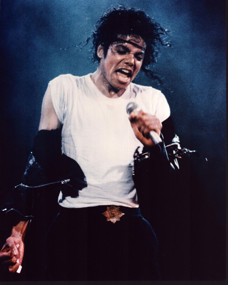 Michael Jackson performing in white shirt and leather jacket photo print.