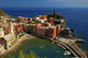 Vernazza Poster Print by Siep Bueneker showcasing colorful houses and coastal views.