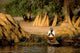 Local Man Fishing and Piles of Straw in Okavango Delta Poster Print by Pete Oxford