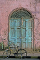 Door in Luxor, Egypt Poster Print by Janis Miglavs showcasing intricate architecture.