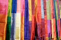 Colorful Silk Scarves at Edfu Market poster print by Michele Molinari