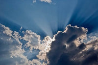 Sunbeams streaking through clouds over Masai Mara, Kenya poster print by Adam Jones.