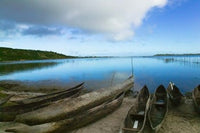 Canoes on the beach in Antananarivo, Madagascar poster print by Keren Su.