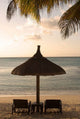 Vibrant Mauritius beach scene poster print featuring umbrellas, chairs, and palm fronds.