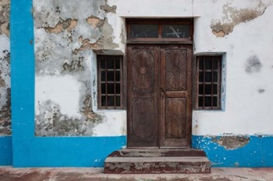 Traditional carved door in Quirmbas National Park poster print by Alida Latham.
