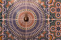 Close-up of Morocco tile design patterns around faucet captured by Bill Young