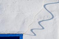 Asilah Wall Shadow Poster Print showcasing Moroccan architecture and shadows.