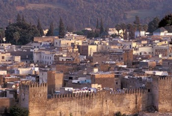 City Walls, Morocco Poster Print by John & Lisa Merrill showcasing vibrant architecture.