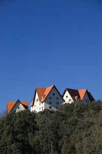 Al-Akhawayn University Buildings poster print by Walter Bibikow showcasing the Alpine Resort in Ifrane, Morocco.