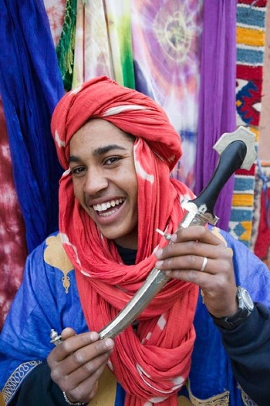 Moroccan Souvenir Seller Poster Print by Walter Bibikow