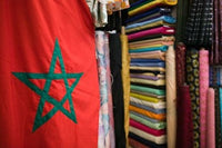 Moroccan Flag Poster Print featuring the Souqs of Marrakech by Walter Bibikow