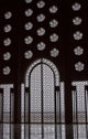 Archway in Al-Hassan II Mosque poster print by William Sutton, showcasing intricate architectural details.