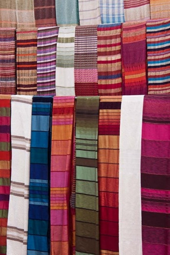 Woven Fabrics of Morocco Poster Print by William Sutton showcasing intricate patterns and vibrant colors.