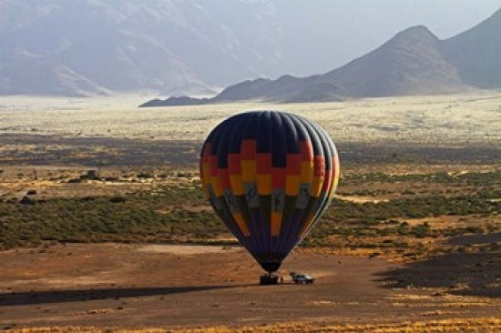 Aerial view of hot air balloon landing in Namib Desert poster print by David Wall.