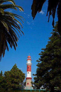 Swakopmund Lighthouse Poster Print by David Wall showcasing the beautiful coastal landmark.