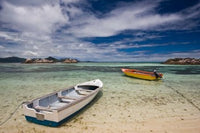 Seychelles La Digue Island fishing boats poster print by Walter Bibikow.