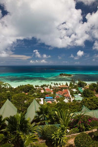 Seychelles Anse Volbert Tourist Village Poster Print by Walter Bibikow