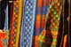 Cloth Stall African Curio Market Poster Print by David Wall showcasing vibrant colors and cultural details.