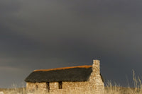 A stone house on the desert in Kgalagadi Transfrontier Park, South Africa - Poster Print