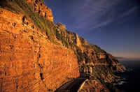 Chapman's Peak Drive Cliffs Poster Print by Nik Wheeler showcasing South Africa's scenic beauty.