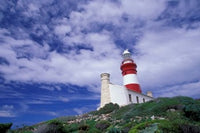 Agulhas Lighthouse Poster Print by Walter Bibikow showcasing the stunning coastal scenery of South Africa.