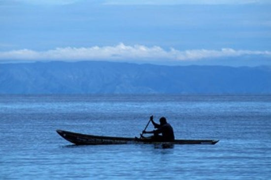 Canoe on Lake Tanganyika art print by Kristin Mosher, depicting a tranquil lake scene.
