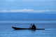 Canoe on Lake Tanganyika art print by Kristin Mosher, depicting a tranquil lake scene.