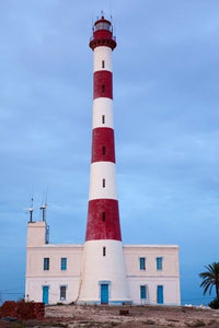Taguermes Lighthouse at Dawn Poster Print by Walter Bibikow, depicting Sidi Mahres Beach, Jerba Island, Tunisia.
