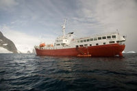 Expedition Ship and Zodiac at Pleneau Island, Antarctica Poster Print