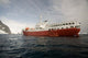 Expedition Ship and Zodiac at Pleneau Island, Antarctica Poster Print
