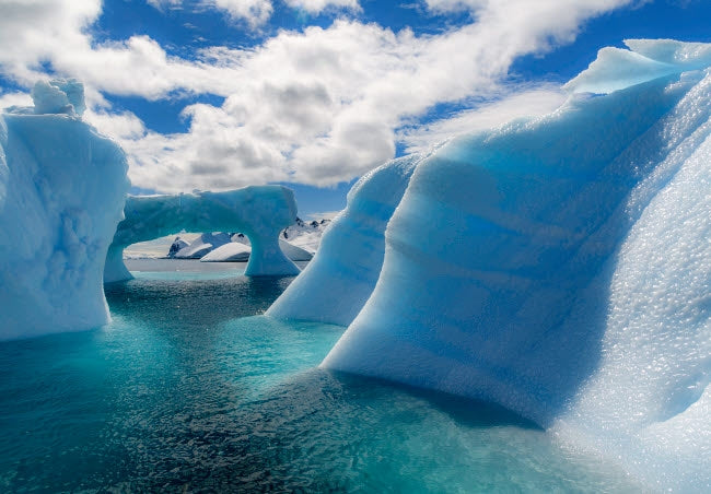 Antarctic Peninsula iceberg poster print by Yuri Choufour, showcasing the beautiful Errera Channel landscape.