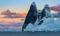 Antarctic Peninsula Sunset Poster Print featuring Lemaire Channel and Una Peaks by Yuri Choufour