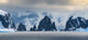 Antarctic Peninsula Poster Print showcasing craggy rocks and mountains by Yuri Choufour