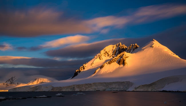 Damoy Point Landscape Poster Print featuring stunning Antarctic scenery by Yuri Choufour.
