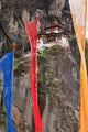 Prayer Flags at Tiger's Nest, Bhutan Poster Print, captures vibrant colors and serene atmosphere.