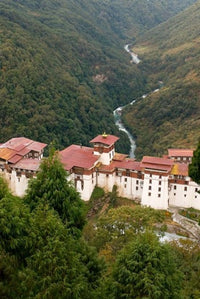 Trongsa Dzong Fortress Poster Print showcasing Bhutan's rice terraces.