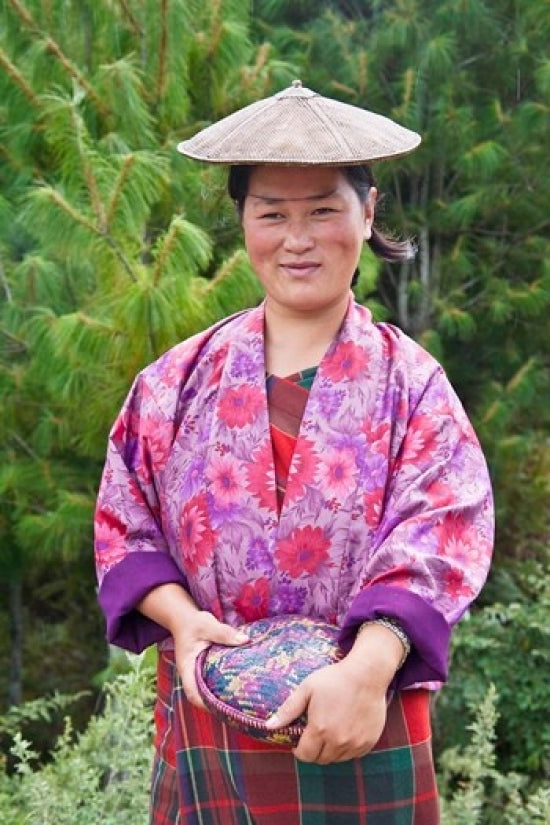 Portrait of a farmer wearing a bamboo hat in Bumthang, Bhutan poster print.