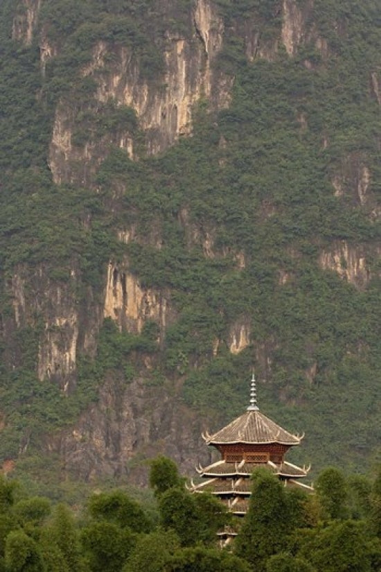 Pagoda and Giant Karst Peak Behind Yangshuo Bridge Poster Print by Adam Jones.