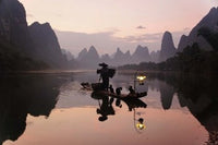 Poster print of a Traditional Chinese Fisherman with Cormorants on the Li River in Guilin, China.