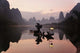 Poster print of a Traditional Chinese Fisherman with Cormorants on the Li River in Guilin, China.