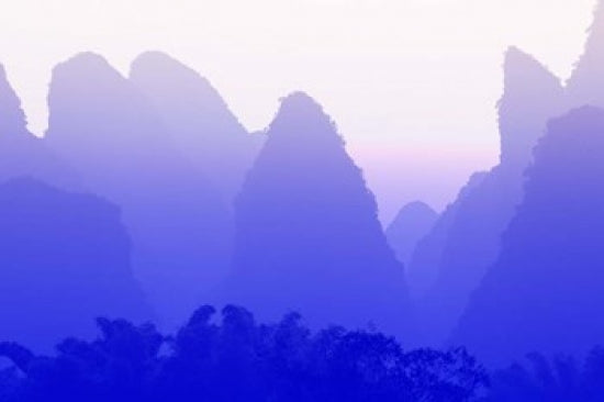 Karst formations along the Yulong River in China poster print by Adam Jones.