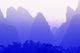 Karst formations along the Yulong River in China poster print by Adam Jones.